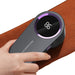 Electric lint remover in use, featuring a hand holding the device over a fabric surface for efficient lint removal.